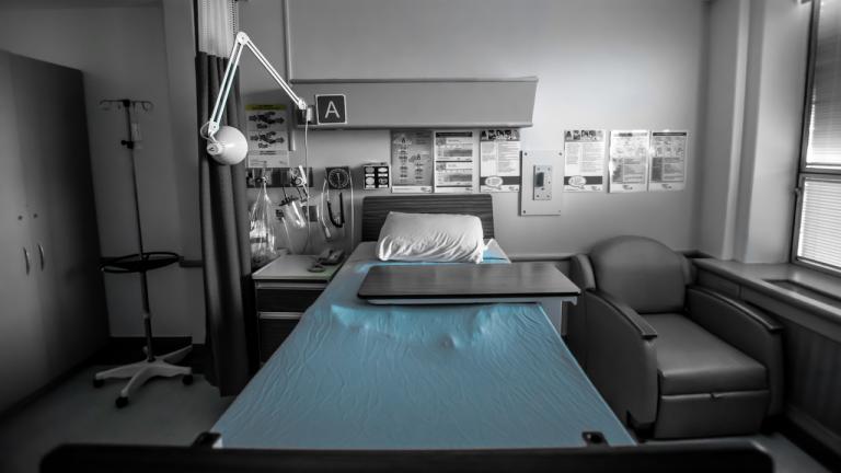 empty hospital bed surrounded by medical equipment from the article Ontarians will suffer and die for years to come because of COVID-19