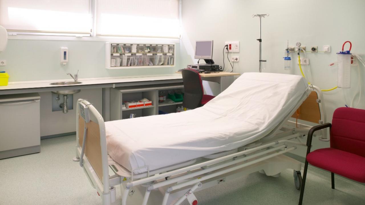 a bed in a medical exam room