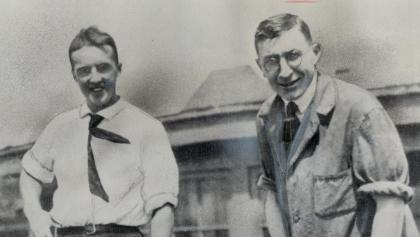 black and white photo of two smiling men from the article Booze, paranoia, and black eyes: The true story behind the discovery of insulin