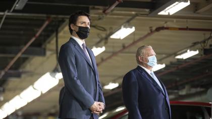 two masked men in suits  from the article What the Liberal-NDP deal in Ottawa could mean for Ontario